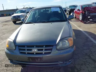 2004 Hyundai Accent GL with VIN KMHCG45C04U531177, listed as a IAAI auction lot 41526033 with 126,102 mi miles. Bid and sale history available at carsss.com. Image 12.
