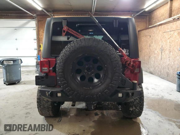 2012 Jeep Wrangler Unlimited Sport z VIN 1C4BJWDG8CL282181, wystawiony jako Copart lot #53863375 z przebiegiem 92 984 mil mil oraz Szkoda całkowita • Salvage title. Historia ofert i sprzedaży dostępna na DreamBid. Obrazek 6.