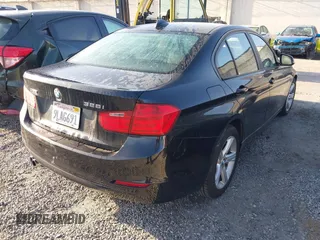 2015 BMW 3 Series 328i xDrive with VIN WBA3B3C57FF547110, listed as a IAAI auction lot 41870141 with 49,412 mi miles and . Bid and sale history available at carsss.com. Image 4.