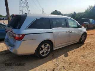 2012 Honda Odyssey Touring с VIN 5FNRL5H93CB137468, выставлен на аукционе Copart как лот 59330545 с пробегом 105 880 миль миль и Списание • Salvage title. История ставок и продаж доступна на DreamBid. Изображение 3.