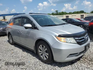 2014 Honda Odyssey EX-L with VIN 5FNRL5H63EB042207, listed as a Copart auction lot 61957605 with 204,563 mi miles and Salvage title. Bid and sale history available at DreamBid. Image 4.