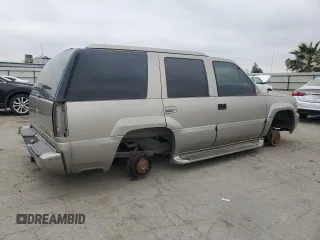 1999 Cadillac Escalade z VIN 1GYEK13R5XR415895, wystawiony jako Copart lot #87112044 z przebiegiem 141 662 mil mil oraz Tytuł czysty. Historia ofert i sprzedaży dostępna na DreamBid. Obrazek 3.