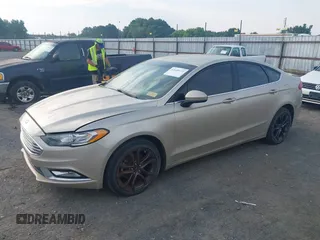 2018 Ford Fusion SE z VIN 3FA6P0HD6JR279927, wystawiony jako IAAI lot #42430172 z przebiegiem 145 080 mil mil oraz . Historia ofert i sprzedaży dostępna na DreamBid. Obrazek 21.