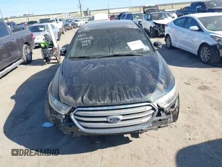 2014 Ford Taurus SEL z VIN 1FAHP2E84EG170133, wystawiony jako IAAI lot #41045369 z przebiegiem 261 732 mil mil oraz . Historia ofert i sprzedaży dostępna na DreamBid. Obrazek 13.