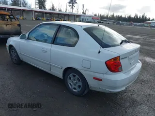 2004 Hyundai Accent GL with VIN KMHCG35C74U303431, listed as a IAAI auction lot 41725717 with 211,893 mi miles. Bid and sale history available at carsss.com. Image 3.