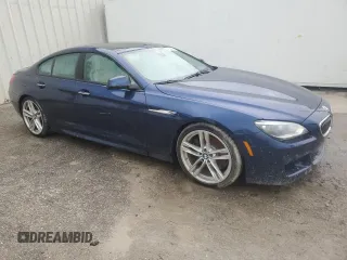 2015 BMW 6 Series 640i with VIN WBA6A0C59FGB53667, listed as a Copart auction lot 74034834 with Not Provided miles and Salvage Title. Bid and sale history available at DreamBid. Image 4.