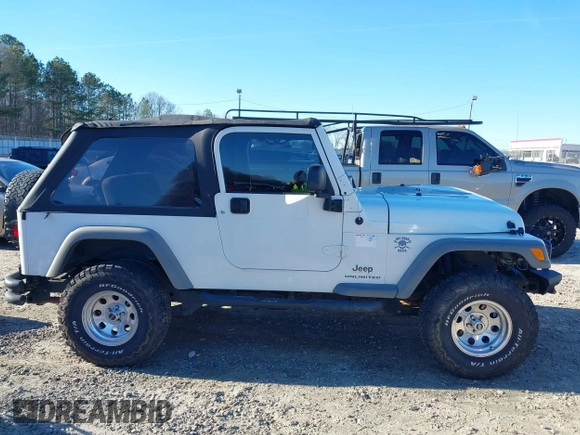 2005 Jeep Wrangler Unlimited with VIN 1J4FA44SX5P316055, listed as a IAAI auction lot 41586898 with 218,181 mi miles. Bid and sale history available at carsss.com. Image 13.