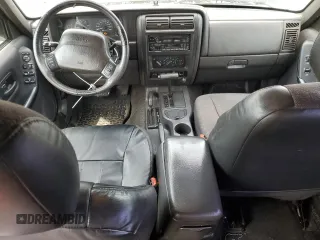 1999 Jeep Cherokee Sport with VIN 1J4FF68S9XL635836, listed as a Copart auction lot 59573195 with 187,035 mi miles and Salvage title. Bid and sale history available at DreamBid. Image 8.