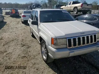 1996 Jeep Grand Cherokee Laredo with VIN 1J4FX58SXTC349575, listed as a Copart auction lot 80545584 with 302,636 mi miles and Salvage Title. Bid and sale history available at carsss.com. Image 11.