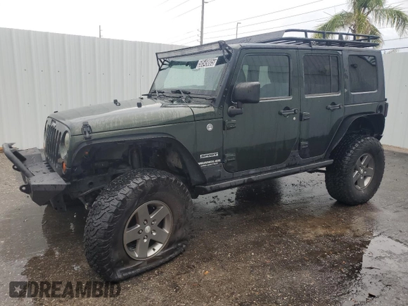 2012 Jeep Wrangler Unlimited Sport with VIN 1C4HJWDG8CL122067, listed as a Copart auction lot 58549805 with 124,658 mi miles and Clean title. Bid and sale history available at DreamBid. Image 1.
