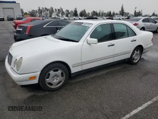 1997 Mercedes-Benz E-Class with VIN WDBJF72F2VA099305, listed as a Copart auction lot 48007935 with 96,410 mi miles and Salvage Title. Bid and sale history available at carsss.com. Image 1.