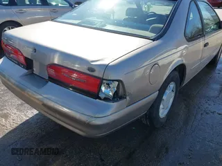 1995 Ford Thunderbird LX with VIN 1FALP62W9SH206490, listed as a IAAI auction lot 41744430 with 111,365 mi miles. Bid and sale history available at carsss.com. Image 6.