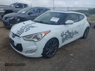 2013 Hyundai Veloster w/Gray Int z VIN KMHTC6AD3DU131703, wystawiony jako IAAI lot #42468831 z przebiegiem 188 513 mil mil oraz . Historia ofert i sprzedaży dostępna na DreamBid. Obrazek 2.