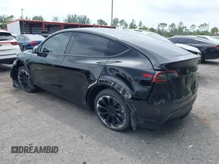 2023 Tesla Model Y Long Range with VIN 7SAYGAEE8PF928923, listed as a IAAI auction lot 41880988 with 18,468 mi miles. Bid and sale history available at carsss.com. Image 3.