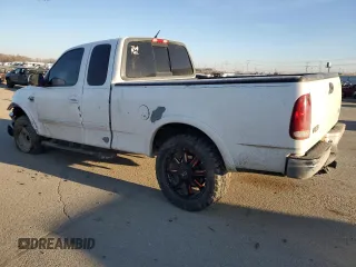 2000 Ford F-150 XL with VIN 1FTRX18L3YKA09007, listed as a Copart auction lot 42828005 with 218,563 mi miles and Salvage Title. Bid and sale history available at carsss.com. Image 2.