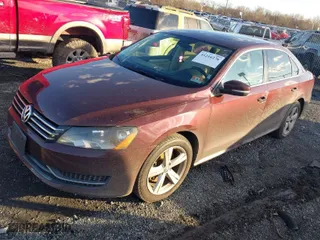 2013 Volkswagen Passat SE w/Sunroof with VIN 1VWBP7A31DC126908, listed as a IAAI auction lot 41216276 with 145,699 mi miles. Bid and sale history available at carsss.com. Image 2.