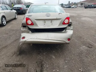 2010 Toyota Corolla with VIN 1NXBU4EE7AZ297198, listed as a IAAI auction lot 42080980 with 142,176 mi miles. Bid and sale history available at carsss.com. Image 6.