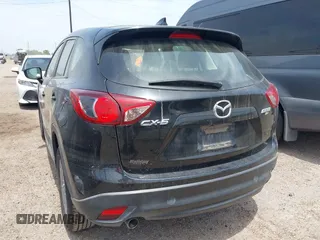 2016 Mazda CX-5 Sport with VIN JM3KE2BY8G0847018, listed as a IAAI auction lot 42064726 with 69,017 mi miles and . Bid and sale history available at DreamBid. Image 3.