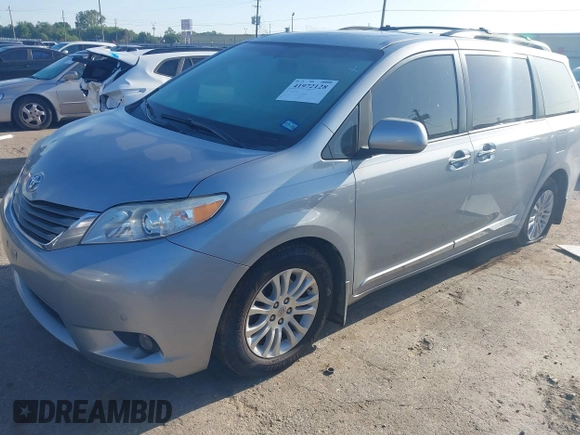 2014 Toyota Sienna XLE with VIN 5TDYK3DC8ES423450, listed as a IAAI auction lot 41972128 with 145,374 mi miles. Bid and sale history available at carsss.com. Image 2.