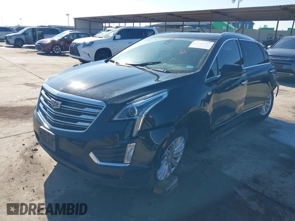 2019 Cadillac XT5 FWD with VIN 1GYKNARS7KZ117913, listed as a IAAI auction lot 41228767 with 105,335 mi miles and . Bid and sale history available at carsss.com. Image 18.