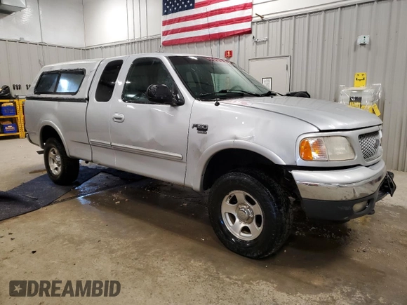1999 Ford F-150 with VIN 1FTRX18W2XKB01444, listed as a Copart auction lot 52717195 with 210,581 mi miles and Clean title. Bid and sale history available at DreamBid. Image 4.