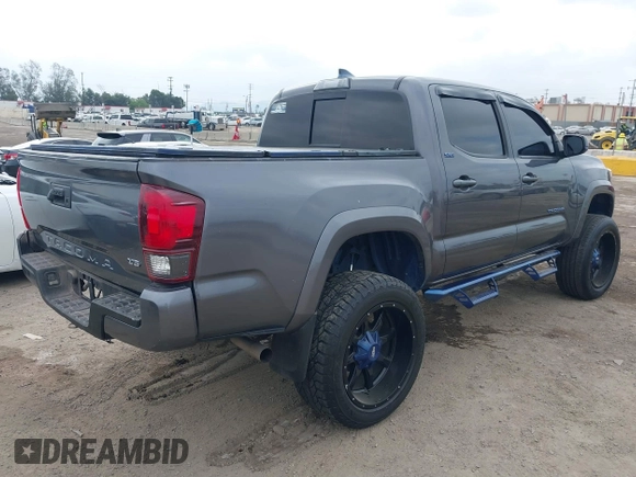 2018 Toyota Tacoma SR5 with VIN 5TFAZ5CNXJX066952, listed as a IAAI auction lot 41894562 with 141,818 mi miles and . Bid and sale history available at DreamBid. Image 4.