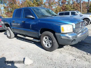 2005 Dodge Dakota SLT with VIN 1D7HE48N25S335869, listed as a IAAI auction lot 40953182 with 287,659 mi miles. Bid and sale history available at carsss.com. Image 1.