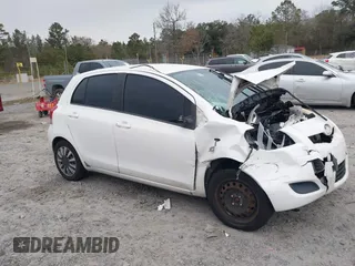 2009 Toyota Yaris with VIN JTDKT903595236903, listed as a IAAI auction lot 41309108 with 140,624 mi miles. Bid and sale history available at carsss.com. Image 1.
