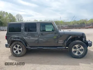 2017 Jeep Wrangler Unlimited Sahara with VIN 1C4BJWEGXHL595724, listed as a IAAI auction lot 42018264 with 95,948 mi miles. Bid and sale history available at carsss.com. Image 13.