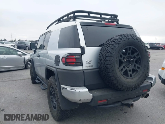 2007 Toyota FJ Cruiser with VIN JTEBU11F370036941, listed as a IAAI auction lot 42024330 with 164,703 mi miles. Bid and sale history available at carsss.com. Image 3.