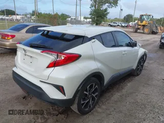 2018 Toyota C-HR XLE with VIN JTNKHMBX3J1010211, listed as a IAAI auction lot 40799443 with 104,148 mi miles. Bid and sale history available at carsss.com. Image 4.