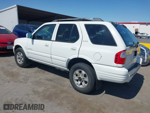 2001 Isuzu Rodeo S with VIN 4S2CK58W614332181, listed as a IAAI auction lot 42585130 with 196,497 mi miles and . Bid and sale history available at DreamBid. Image 3.