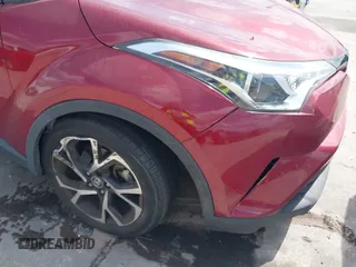 2019 Toyota C-HR XLE with VIN JTNKHMBX0K1017215, listed as a IAAI auction lot 41898189 with 74,239 mi miles. Bid and sale history available at carsss.com. Image 6.