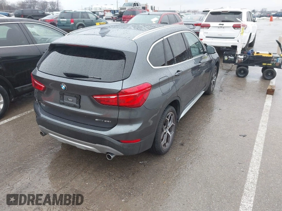 2019 BMW X1 sDrive28i with VIN WBXHU7C52K5L12160, listed as a IAAI auction lot 41452244 with 59,344 mi miles and . Bid and sale history available at DreamBid. Image 4.