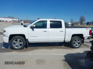 2018 Chevrolet Silverado 1500 LT with VIN 3GCUKREC3JG634354, listed as a IAAI auction lot 41734436 with 135,846 mi miles. Bid and sale history available at carsss.com. Image 14.