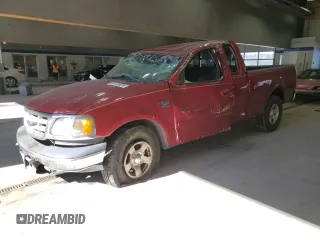2001 Ford F-150 with VIN 2FTRX17W71CB06393, listed as a Copart auction lot 83135674 with 143,416 mi miles and Salvage Title. Bid and sale history available at DreamBid. Image 1.