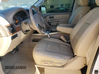 2015 Nissan Armada SV z VIN 5N1BA0ND8FN616053, wystawiony jako Copart lot #88253385 z przebiegiem 211 004 mil mil oraz Szkoda całkowita • Salvage title. Historia ofert i sprzedaży dostępna na DreamBid. Obrazek 7.