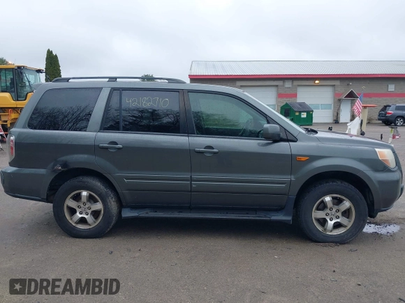 2007 Honda Pilot EX-L with VIN 2HKYF18667H526601, listed as a IAAI auction lot 42182710 with 221,948 mi miles and . Bid and sale history available at carsss.com. Image 14.