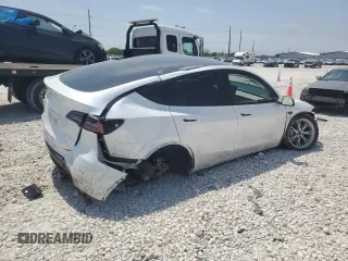 2023 Tesla Model Y Long Range z VIN 7SAYGDEE4PA064502, wystawiony jako Copart lot #53337645 z przebiegiem 16 945 mil mil oraz Szkoda całkowita • Salvage title. Historia ofert i sprzedaży dostępna na DreamBid. Obrazek 3.