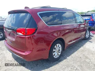 2017 Chrysler Pacifica Touring L with VIN 2C4RC1BG0HR591124, listed as a IAAI auction lot 42138595 with 113,071 mi miles and . Bid and sale history available at DreamBid. Image 4.