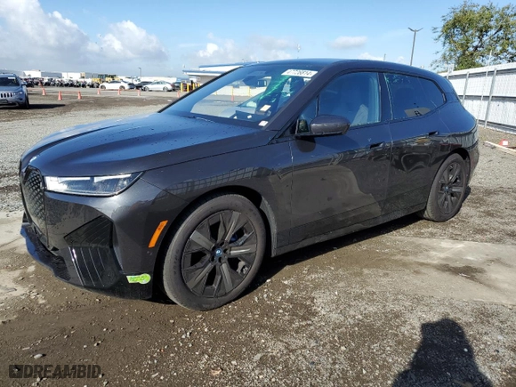 2023 BMW iX xDrive50 with VIN WB523CF02PCM92379, listed as a Copart auction lot 47726814 with 7,721 mi miles. Bid and sale history available at carsss.com. Image 1.