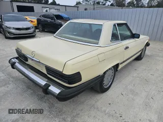 1987 Mercedes-Benz 560 SL with VIN WDBBA48D5HA061899, listed as a Copart auction lot 87742235 with 68,292 mi miles and Salvage Title. Bid and sale history available at DreamBid. Image 4.
