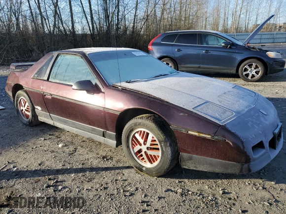 1986 Pontiac Fiero z VIN 1G2PF3793GP210763, wystawiony jako Copart lot #41891075 z przebiegiem 144 219 mil mil oraz Czysty tytuł • Clean title. Historia ofert i sprzedaży dostępna na DreamBid. Obrazek 4.