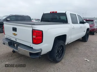 2018 Chevrolet Silverado 1500 LT with VIN 3GCPCREC7JG402401, listed as a IAAI auction lot 41880462 with 128,995 mi miles and . Bid and sale history available at DreamBid. Image 4.