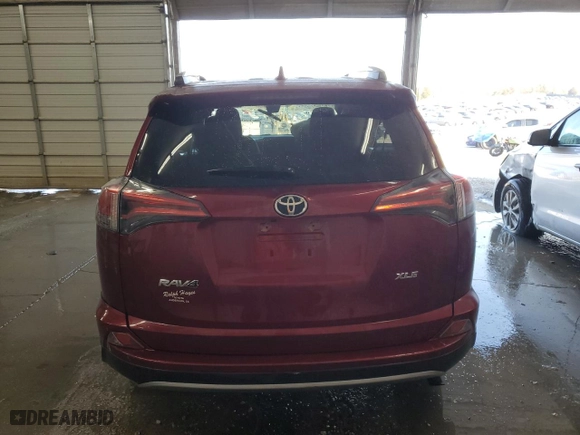 2018 Toyota RAV4 XLE with VIN 2T3WFREV5JW495584, listed as a Copart auction lot 48867725 with 34,060 mi miles and Salvage Title. Bid and sale history available at carsss.com. Image 6.