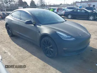 2019 Tesla Model 3 Mid Range with VIN 5YJ3E1EA0KF401803, listed as a IAAI auction lot 41202347 with 123,334 mi miles. Bid and sale history available at carsss.com. Image 1.
