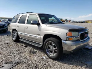 2004 GMC Yukon SLT with VIN 1GKEK13Z04J140148, listed as a Copart auction lot 52411494 with 167,629 mi miles and Salvage Title. Bid and sale history available at carsss.com. Image 4.