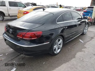 2014 Volkswagen CC R-Line with VIN WVWBN7ANXEE521055, listed as a IAAI auction lot 41197539 with 94,902 mi miles. Bid and sale history available at carsss.com. Image 4.