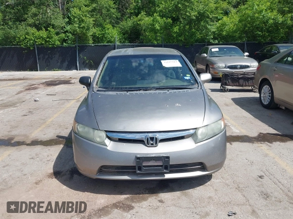 2006 Honda Civic LX z VIN 1HGFA16586L083119, wystawiony jako IAAI lot #42237313 z przebiegiem Nie podano mil oraz . Historia ofert i sprzedaży dostępna na DreamBid. Obrazek 13.