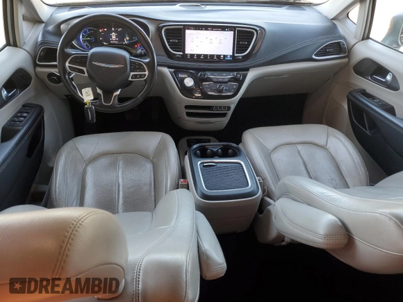 2021 Chrysler Pacifica Hybrid Touring L with VIN 2C4RC1L7XMR593911, listed as a Copart auction lot 57842415 with 74,910 mi miles and Salvage title. Bid and sale history available at DreamBid. Image 8.
